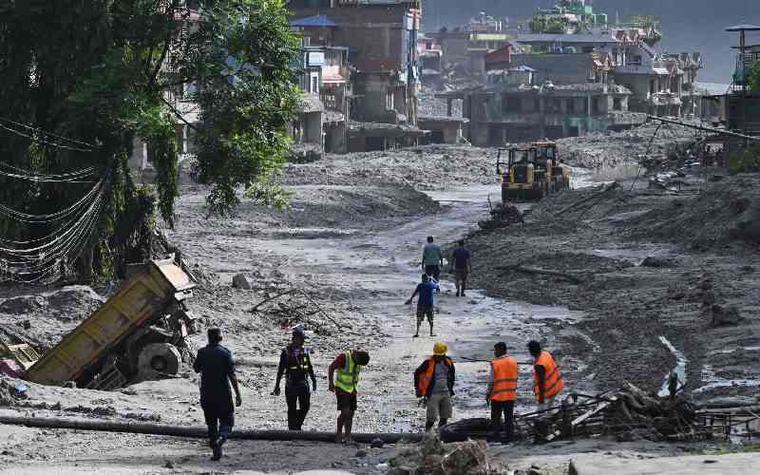 Rescuers dig into tunnel as missing toll from Nepal, China flood tops 3,000