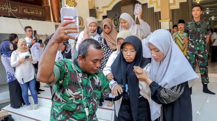 Around 2,000 fall ill after eating free school meals The meals were provided through a multibillion-dollar scheme that is one of President Subianto's key policies.